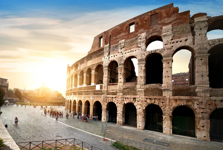 Ancient Colosseum in Rome at sunset - Essential Destination for Rome Travel Guide