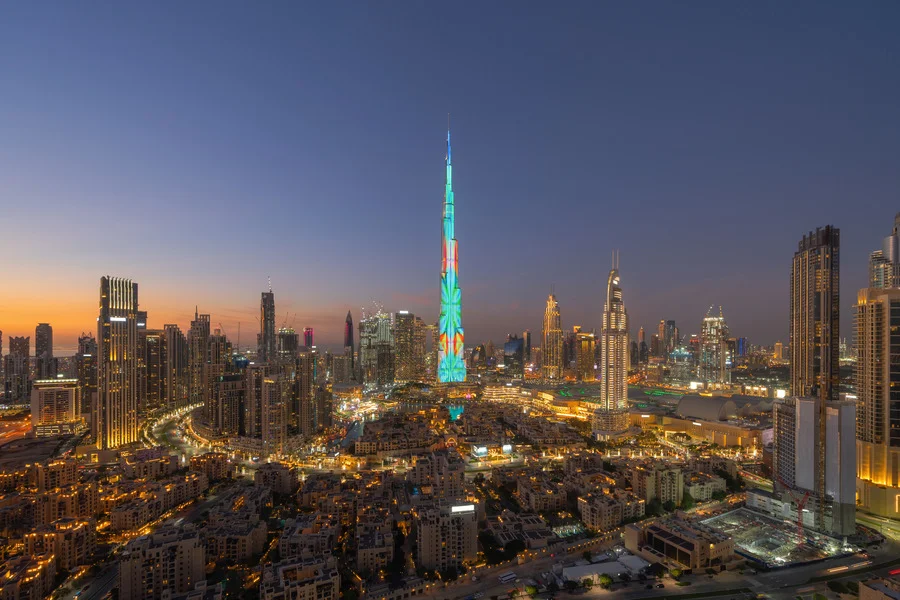 Burj Khalifa dominating the Dubai Downtown skyline, UAE, with urban cityscape - essential in any Dubai travel guide.
