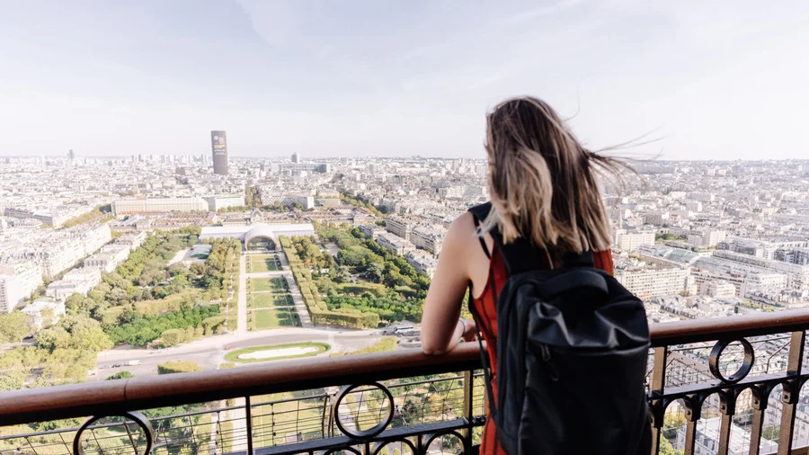 Tourist enjoying the view of Paris from the Eiffel Tower