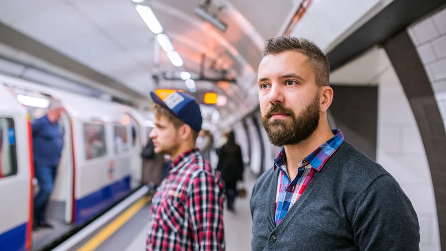 Hipster men waiting at London Underground platform