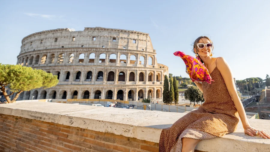 Woman exploring Coliseum in Rome, featured in Rome travel guide.