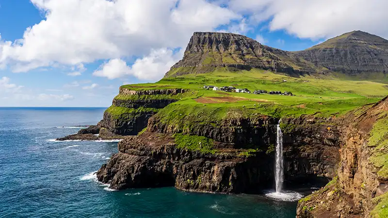 Gásadalur village in the Faroe Islands, a perfect example of lesser-known tourist spots in Europe.