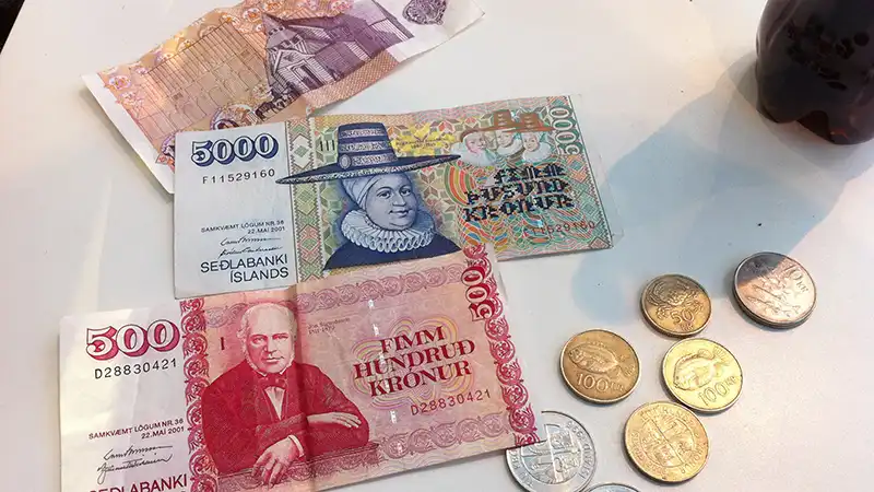 Icelandic króna notes and coins used for expenses in a Reykjavik 3 day travel itinerary.