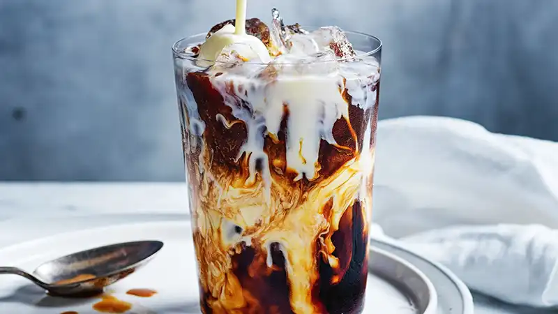 Refreshing Vietnamese iced coffee with condensed milk in a glass