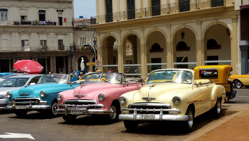 Colorful Almendrones taxis, vintage American cars, lined up for shared rides