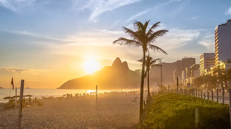 Sunset at Ipanema Beach with the Two Brothers Mountain, a highlight in a 5-day itinerary in Rio de Janeiro.