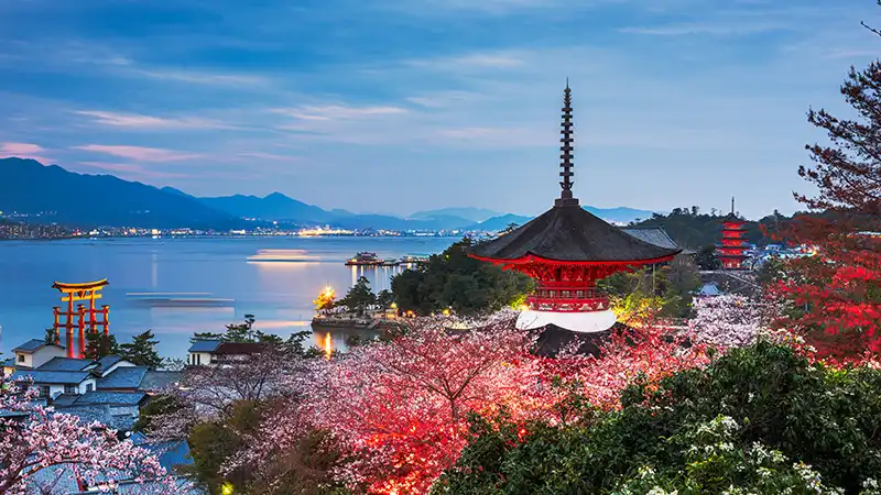 Springtime view of Miyajima Island, a popular destination for all-inclusive vacations with airfare packages to Hiroshima, Japan.