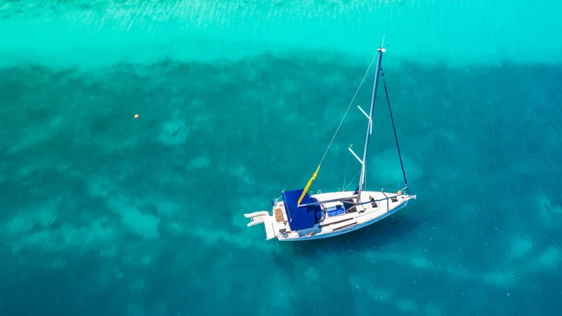 Luxury yacht sailing near Cancun, a gateway to Caribbean adventures.