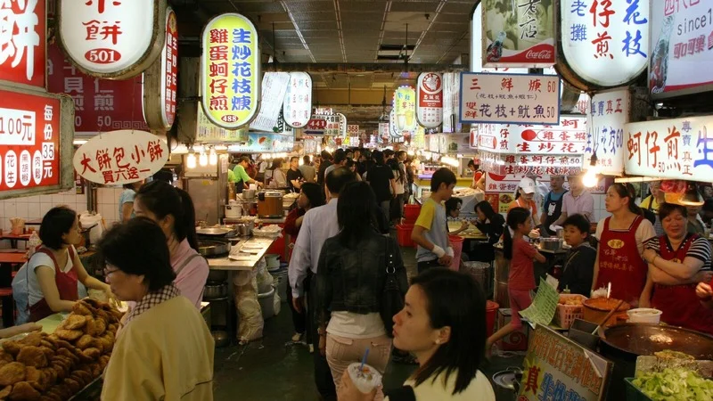 Vibrant food stalls at Shilin Night Market, a popular culinary destination in Taipei.