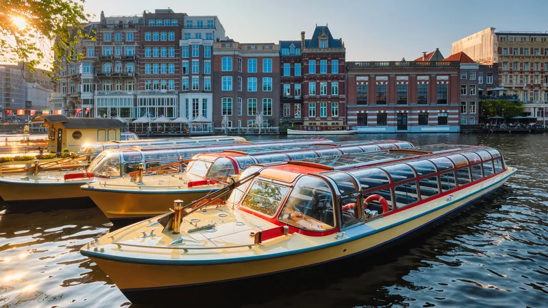 Boat ride along the serene canals of Amsterdam, a must-do activity for visitors.